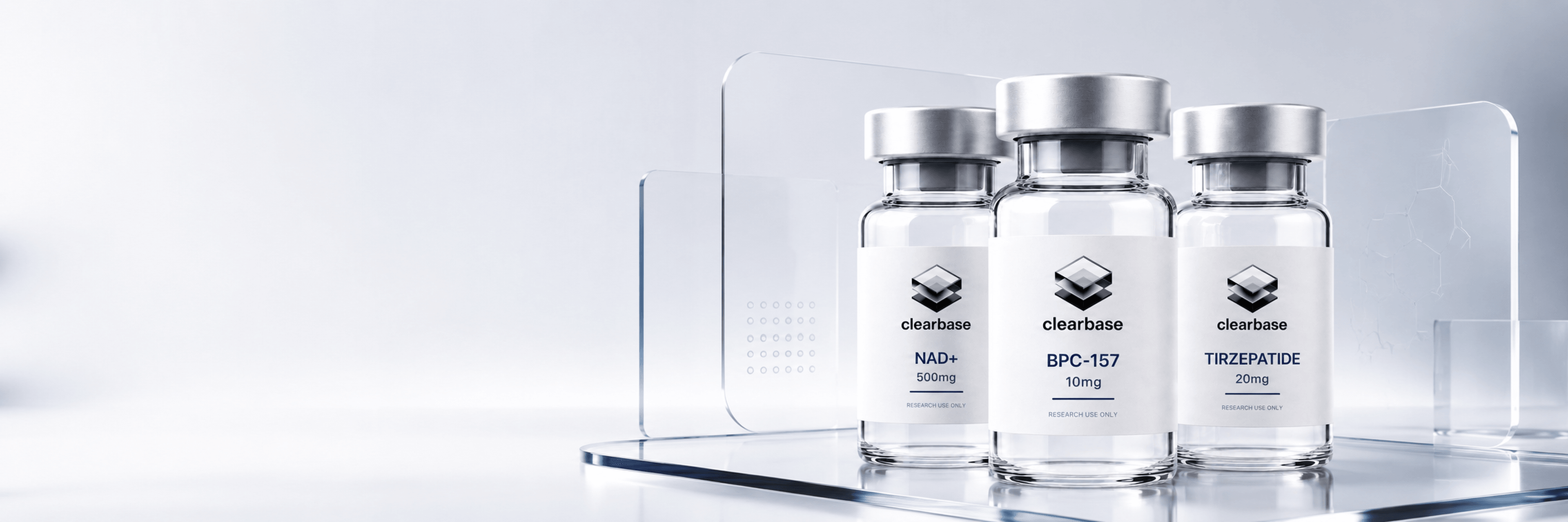 Research-grade clearbase peptide vials — NAD+, BPC-157 and tirzepatide on a clinical bench